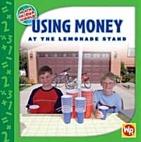 Using Money at the Lemonade Stand (Library Binding)