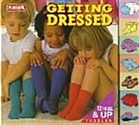 Getting Dressed: Tab Board Book (Tab Board Books) (Board book)